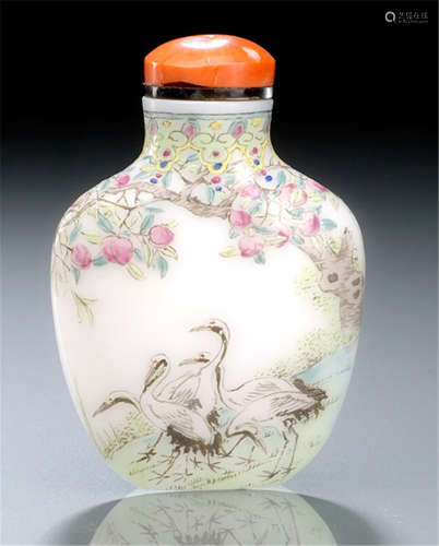 A WHITE PEKINGGLASS SNUFF BOTTLE DECORATED WITH AUSPICIOUS CRANES AND PEACHES WISHING LONGEVITY