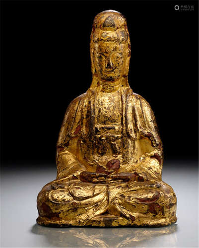 A GILT- AND BLACK-LACQUERED BRONZE FIGURE OF GUANYIN