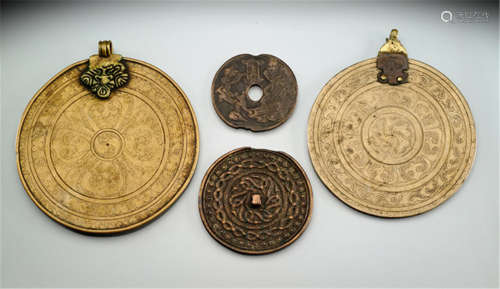 THREE BRONZE MAGIC MIRRORS AND AN AMULET, TIBET, 15th ct