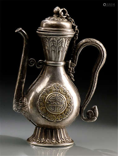 A PARCEL GILT SILVER EWER, TIBET, 19th/20th ct