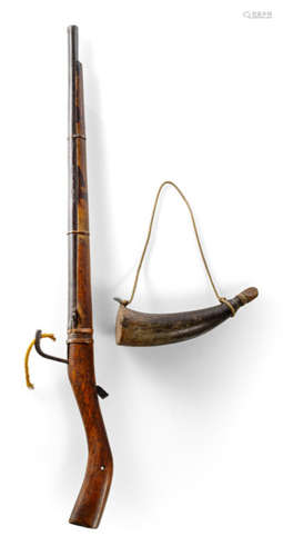 A TANEGASHIMA MATCHLOCK AND A GUNPOWDER HORN, Japan, marked: Masaaki Fukazsashi (kan) hachijûsan-go (No.83), Edo period - Property from a Berlin private collection, according to the present owner formerly part of the Paul Grundmann collection, acquired at Galerie Lemaire, Amsterdam, in the 1960s - Minor wear, the gunpowder horn with traces of worms at the wood cover