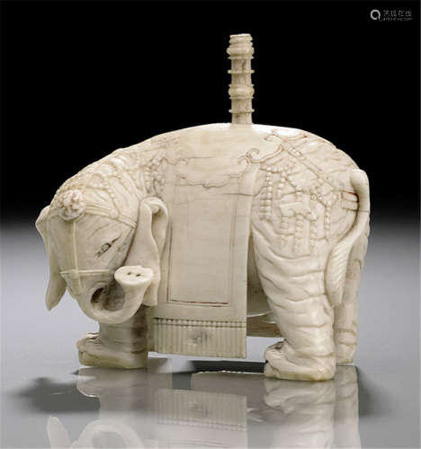 A CARVED IVORY MODEL OF AN ELEPHANT