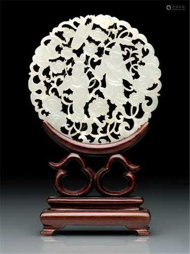 A CIRCULAR CARVED JADE DISC WITH OPENWORK FIGURAL DEPICTION