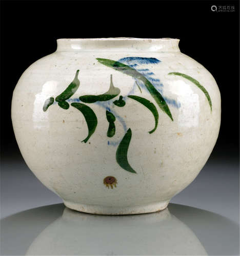 A WHITE GLAZED PORCELAIN VASE, Korea, late Yi Dynasty, decorated with leaves in underglaze blue and dark green - Property from a South German private collection, acquired before 2000 - Minor wear, slightly chipped at the rim and the stand