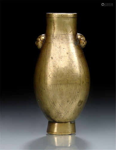 A SMALL BRONZE VASE WITH SILVER INLAYS