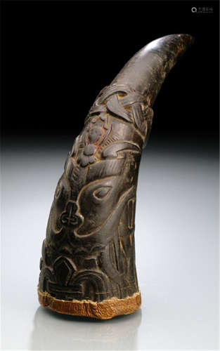 A BUFFALO-HORN RATTLE SCULPTED WITH A DEMONIC FACE, NEPAL-Property from an old German private collection, assembled in the 1970'ies till 1988-Traces of age