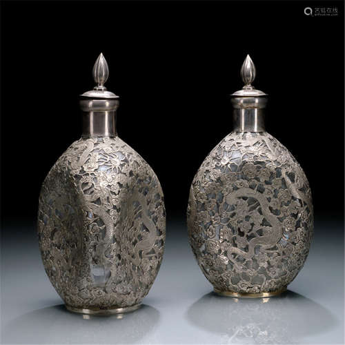 A PAIR OF SILVER-OVERLAID DIMPLE GLASS BOTTLES WITH DRAGON DECOR