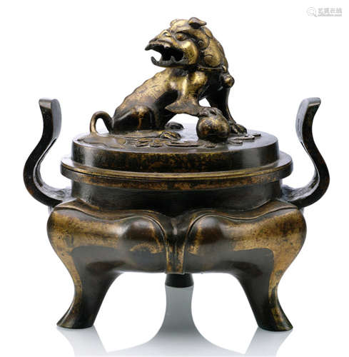 A PART-GILT BRONZE TRIPOD CENSER WITH LION FINIAL, China, Ming dynasty, Jiajing/Wanli period-Property from a German private collection, assembled between 1990 and 2015-Minor wear