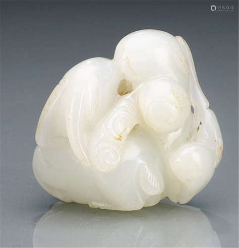 A JADE CARVING OF TWO GOATS AND THEIR KID