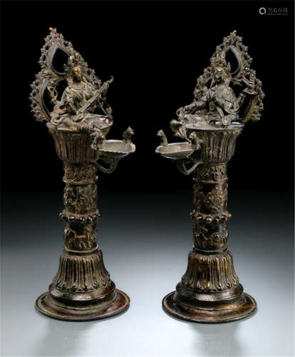 A PAIR OF BRONZE ALTAR CANDLE HOLDERS, Nepal, 19th/20th ct
