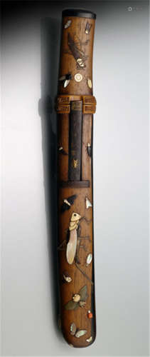 A TANTÔ IN A WOOD SCABBARD, Japan, Meiji period, wood scabbard and hilt with inlaid decoration of insects amongst others a snail, moths, beetles and crickets, details in ivory, horn, red coral and mother-of-pearl, iron kozuka with seal script and seal - Minor wear, blade with light traces of age