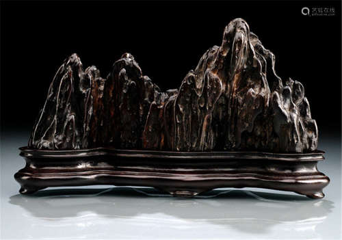 A CARVED ZITAN 'MOUNTAIN' BRUSH REST, China, Qing dynasty