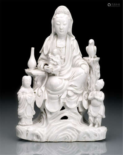 A DEHUA GROUP OF GUANYIN WITH ATTENDENTS ON A ROCK