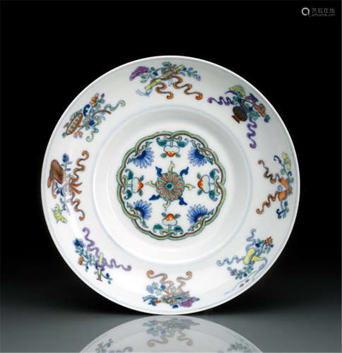 AN IMPERIAL DOUCAI PORCELAIN DISH WITH DAOIST EMBLEMS, China, underglaze blue Qianlong seal mark and period-Property from an old Austrian private collection-Restored break to rim