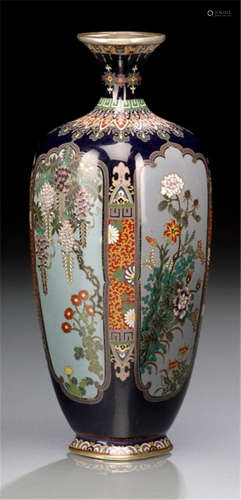 A FINE CLOISONNÉ ENAMEL VASE, Japan, signed Ôhyô (Ôta Hyôzo), Meiji period, decorated with various flowers within four medallions on dark blue ground - Property from a German private collection, acquired before 1990