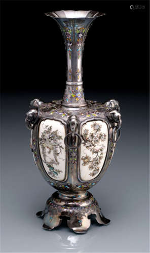 A SILVER AND SHIBAYAMA IVORY VASE, Japan, marked: Arita, Meiji period, hexagonally-lobed vase with six inset ivory panels with floral decorations inlaid in Shibayama style, the flared neck, shoulder and foot inlaid in various coloured cloisonné enamels, six applied silver handles in the form of elephant heads with loose rings - Minor wear, only few inlays re-stuck or repl.