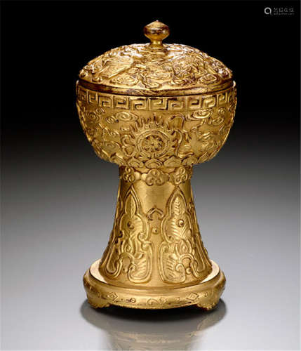 A GILT-DECORATED WOODEN STEM BOWL WITH MOLDED BUDDHIST MOTIFS