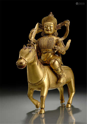 A GILT-BRONZE FIGURE OF KUBERA, TIBETO-CHINESE, 18th ct