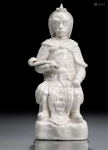 A CREAM-GLAZED PORCELAIN MODEL OF HANUMAN SEATED ON A THRONE WITH RUYI SCEPTER