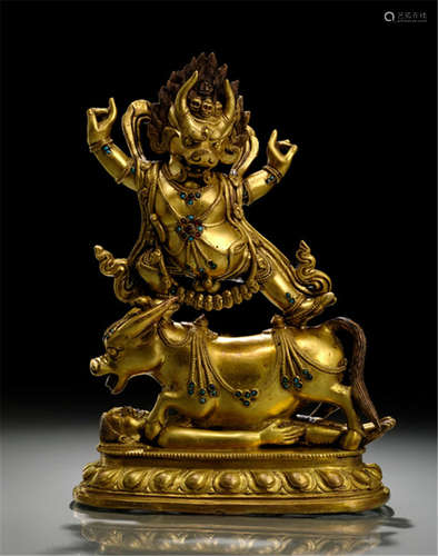 A GILT-BRONZE FIGURE OF DHARMARAJA, TIBET, ca