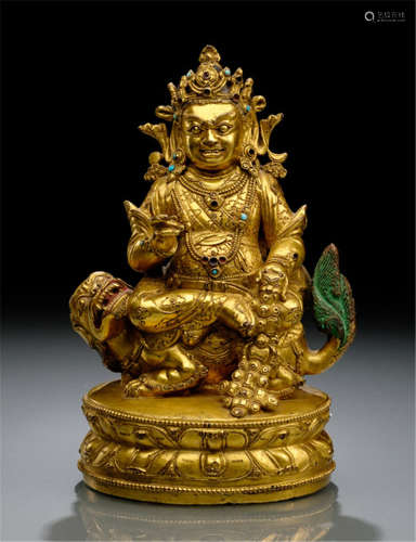 AN IMPORTANT GILT-BRONZE FIGURE OF VAISHRAVANA, TIBET, 15th ct