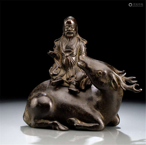 A BRONZE CENSER IN THE FORM OF SHOULAO SEATED ON A DEER