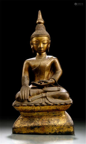 A BRONZE FIGURE OF BUDDHA SHAKYAMUNI, Burma, 19th Ct., seated in vajrasana on a pedestal with his right hand in bhumisparshamudra while the left rests on his lap, wearing samghati and his face displaying a serene expression, traces of gilt- and black-lacquer - Property from an old Bavarian private collection, acquired between 1960 and 1990