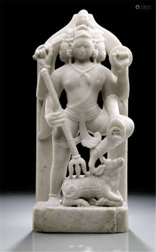 AN ALABASTER STELE DEPICTING SHIVA, North-West India, ca. 19th Ct., standing with one leg on his vehicle Nandi, his four arms radiating around his body and his hands holding trishula, sword, shield and cakra and his head consisting of four faces - Property from a German private collection, assembled between 1966 and 2004 - Minor wear, slightly chipped