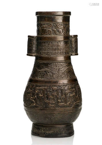 A RARE BRONZE HU-SHAPED VASE IN ARCHAIC STYLE