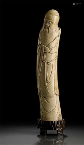 AN IVORY MODEL OF STANDING SHOULAO WITH FAN