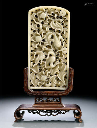A FINE CARVED JADE DRAGON AND LOTOS RETICULATED PANEL, China, Ming dynasty, wood stand-Property from an old Italian private collection, acquired in the 1980s-Slightly chipped