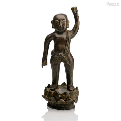 A BRONZE FIGURE OF INFANT BUDDHA ON A SOLID LOTUS STAND