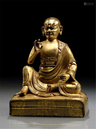 A GILT-BRONZE FIGURE OF AN ARHAT, TIBETO-CHINESE, 18th ct