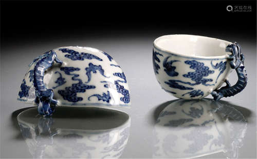 A PAIR OF BLUE AND WHITE BATS AND CLOUDS PORCELAIN CUPS WITH CHILONG HANDLES, China, Guangxu period-Property from a South German private collection, assembled prior 1990-One with chip near handle