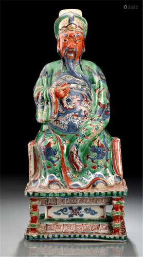 A VERY RARE WUCAI FIGURE OF A SEATED GUANDI, WITH WOOD STAND, China, Wanli period-Property from a French private collection, acquired at Etude Couturier Nicolay S