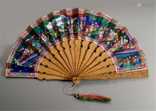A CANTON STYLE FOLDING FAN WITH CARVED STICKS AND COLOURFUL FIGURE PAINTING