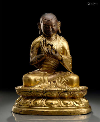 A PARCEL GILT-COPPER EMBOSSED FIGURE OF A LAMA, Tibet, 18th/19th ct