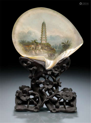 A LARGE CARVED MOTHER-OF-PEARL SHELL WITH THE WHAMPOA PAGODA