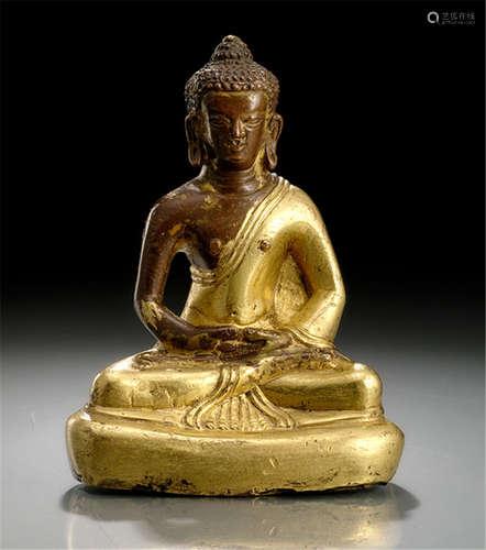 A PARCEL GILT-BRONZE FIGURE OF BUDDHA SHAKYAMUNI, Tibeto-Chineses, 18th ct