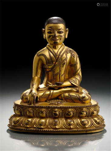 A FINE GILT-BRONZE FIGURE OF A LAMA, TIBET, late 15th ct