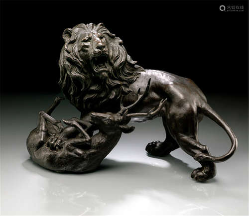 A BRONZE GROUP OF A LION AND A DEER, Japan, marked: Dai Nihon Toyama-ken Takaoka-shi Kita Shigeru Shoten, Meiji period, cast as a standing, roaring lion resting one of his front paws on a captured deer, that lies in front of him - Property from an old South German private collection, assembled between 1970 and 2010 - Minor wear, slightly chipped