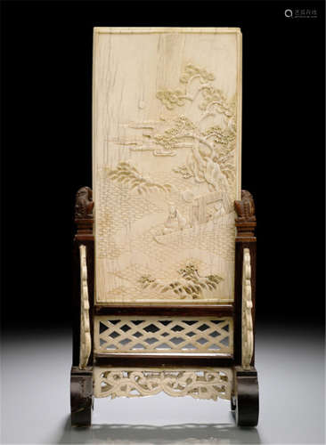 A WELL CARVED IVORY PANEL MOUNTED AS TABLE SCREEN IN A WOOD AND BONE FRAME