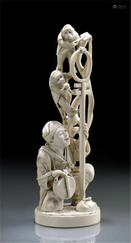 AN IVORY OKIMONO OF A MONKEY TRAINER (SARUMAWASHI), Japan, signed Seisai, Meiji period, the figure carved as kneeing down and holding a drum in the right hand and a stand with two climbing monkeys wearing vests - Minor wear, partly slightly restored