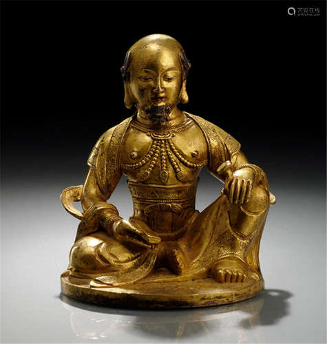 A GILT-BRONZE FIGURE OF A LUOHAN