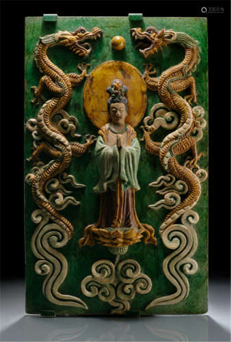 A LARGE GLAZED EARTHENWARE PANEL WITH GUANYIN AND DRAGONS, China, 17th ct