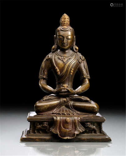 A BRONZE FIGURE OF AMITAYUS, TIBETO-CHINESE, Qing dynasty, seated in vajrasana on a throne with both hands in dhyanamudra, wearing dhoti, scarf draped across his chest, bejewelled, his face displaying a serene expression with downcast eyes below arched eyebrows, his hair combed in a chignon and decorated with a leaf demonstrating swaying tassels, resealed-Property from a Flemish private collection, bought prior 2015-Minor wear