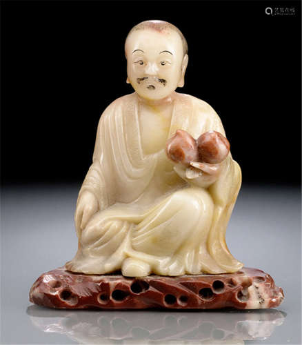 A FINE CARVED SOAPSTONE FIGURE OF A SEATED LUOHAN