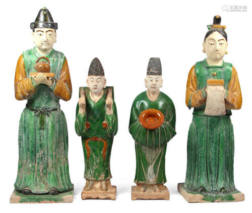 FOUR SANCAI GLAZED EARTHENWARE ATTENDANTS, China, Ming dynasty - Property from a South German private collection - Slightly chipped