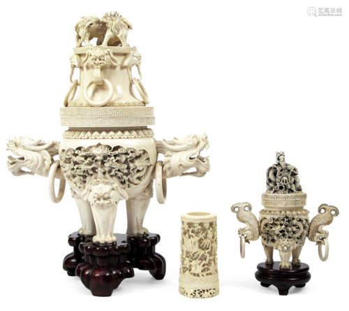 TWO RICHLY CARVED IVORY CENSERS DEPICTING DRAGONS AND A BRUSH HOLDER, China, 20th ct. - Property from an old German private collection, assembled between 1970 and 1990 - Very slightly chipped
