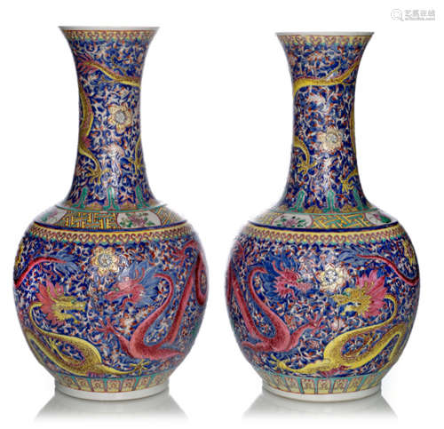 A PAIR OF POLYCHROME DECORATED DRAGON PORCELAIN BOTTLE VASES, China, Qianlong mark, Guangxu/Republic period - Property from a German private collection - Few enamel losses, minor wear
